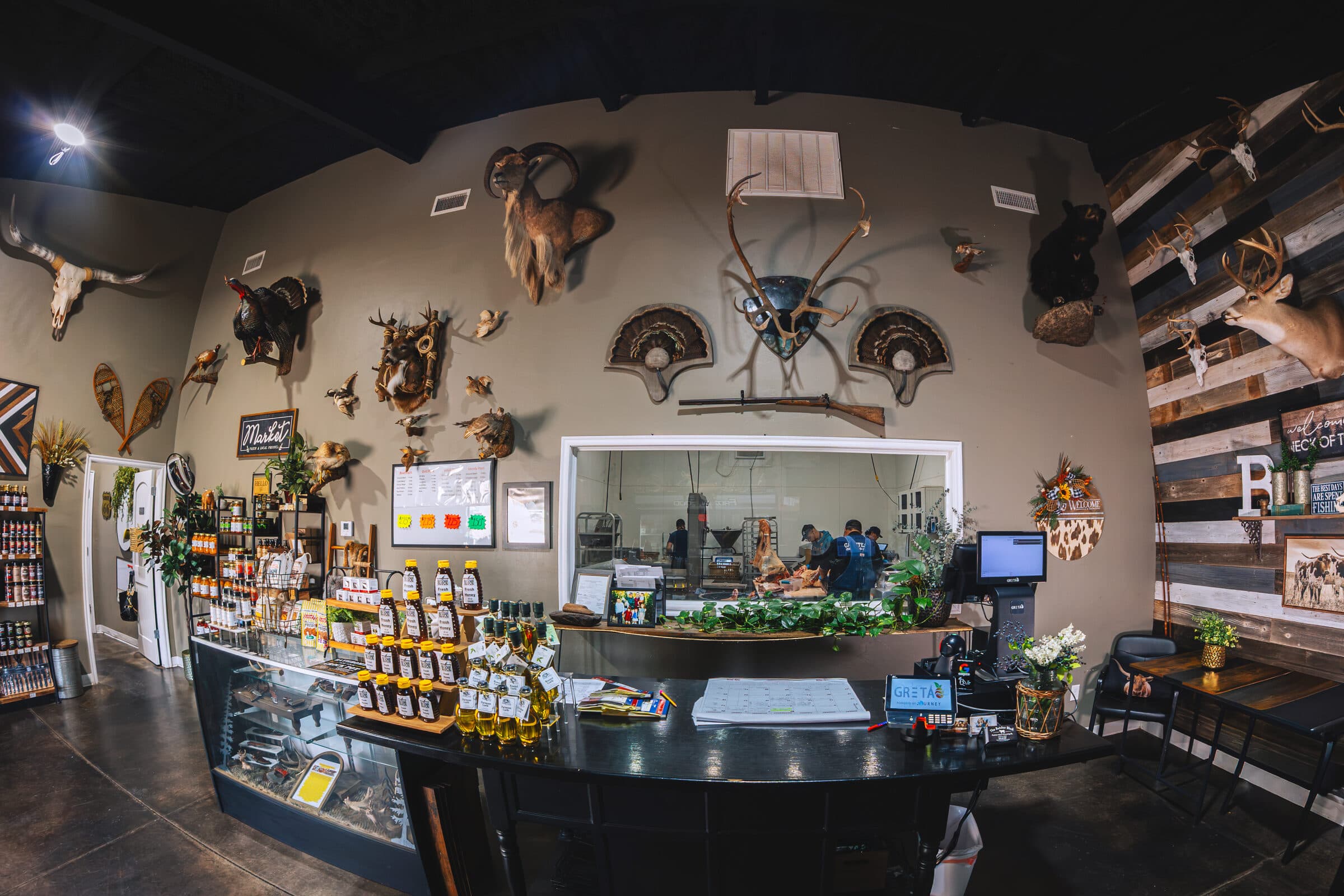 The retail counter inside The Butcher Block, with trophy mounts on the wall