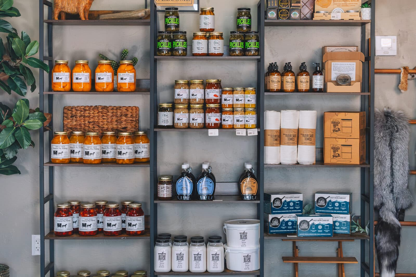 Shelves of Amish jams, pickles, and pie fillings